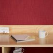 Chilewich Basketweave floor mat in Scarlet, showcasing woven terrastrand yarn texture and modern design aesthetic.