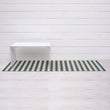 Chilewich striped woven mat with textured terrastrand yarn surface, featuring modern linear design and durable finish.