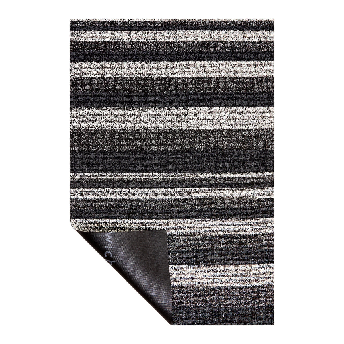 Chilewich striped woven mat with textured terrastrand yarn surface, featuring modern linear design and durable finish.