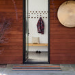 Chilewich striped woven mat with textured terrastrand yarn surface, featuring modern linear design and durable finish.
