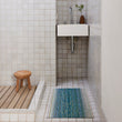 Chilewich woven floor mat in neutral woven terrastrand yarn, durable and stylish for modern living spaces.