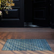 Chilewich striped woven mat with textured terrastrand yarn surface, featuring modern linear design and durable finish.