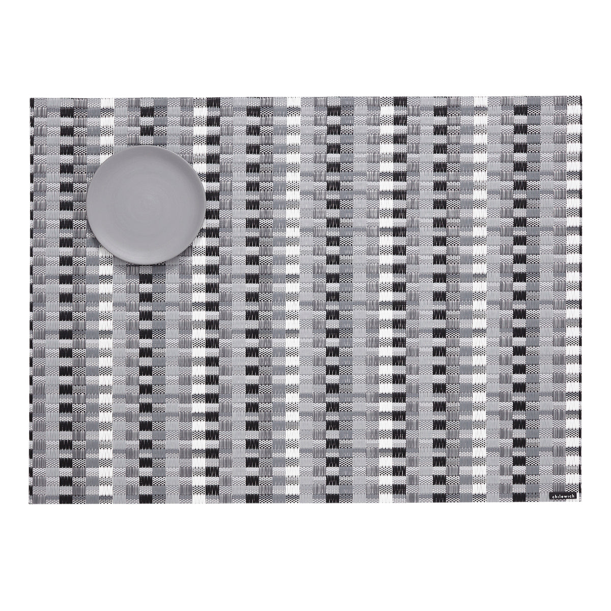 Chilewich woven placemat with subtle texture and contemporary design, ideal for dining and tabletop decor.
