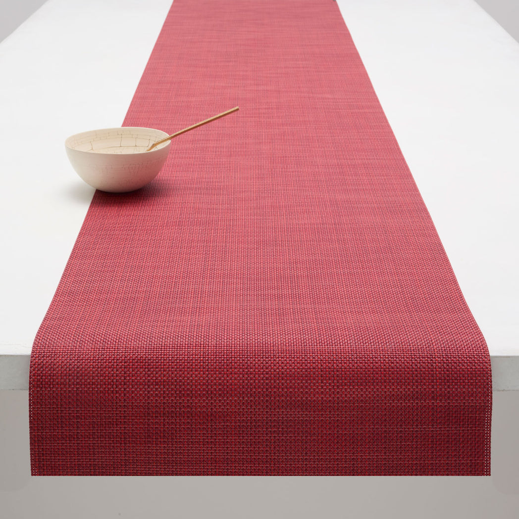 Chilewich Basketweave floor mat in Scarlet, showcasing woven terrastrand yarn texture and modern design aesthetic.