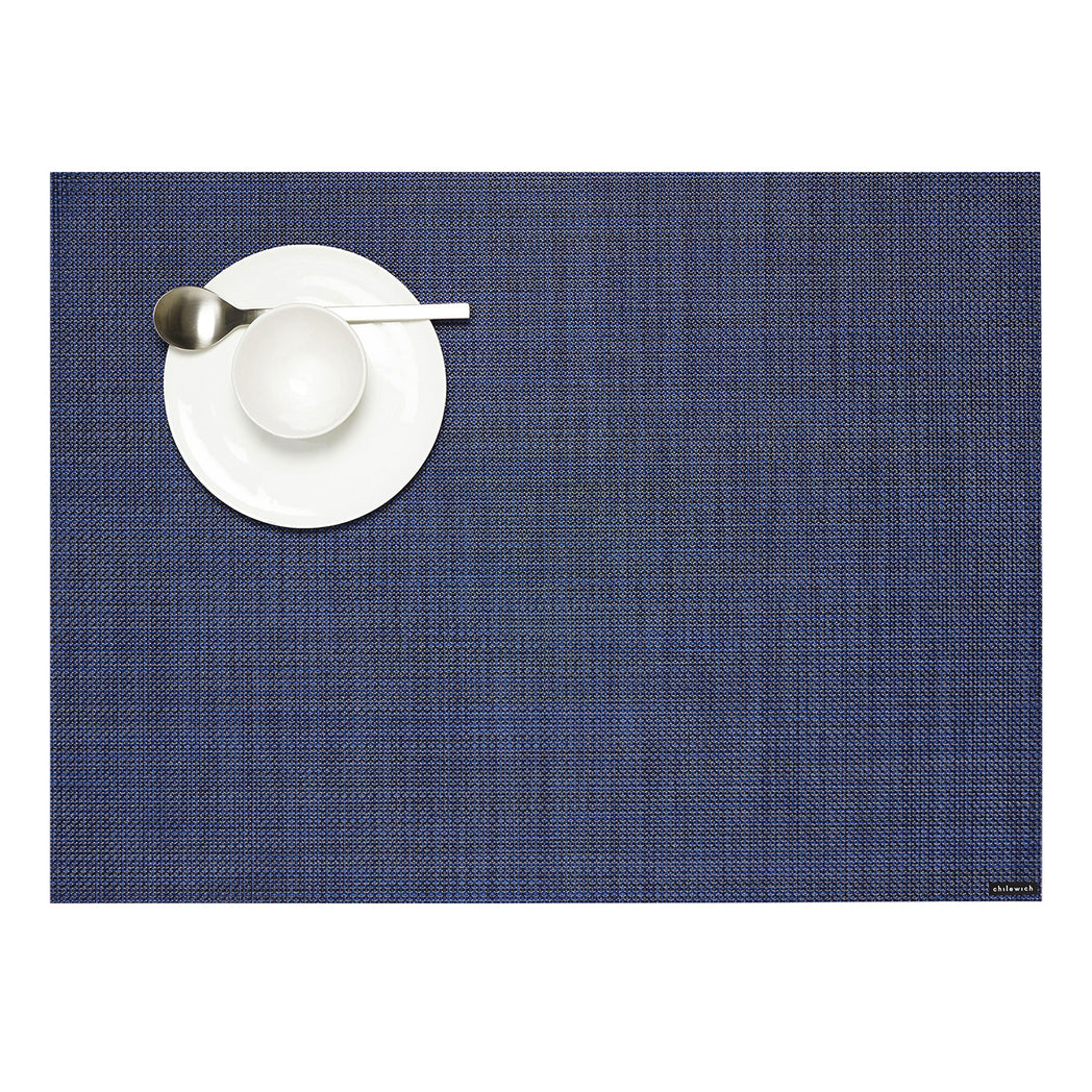 Chilewich Basketweave floor mat in Indigo, showcasing woven terrastrand yarn texture and modern design aesthetic.