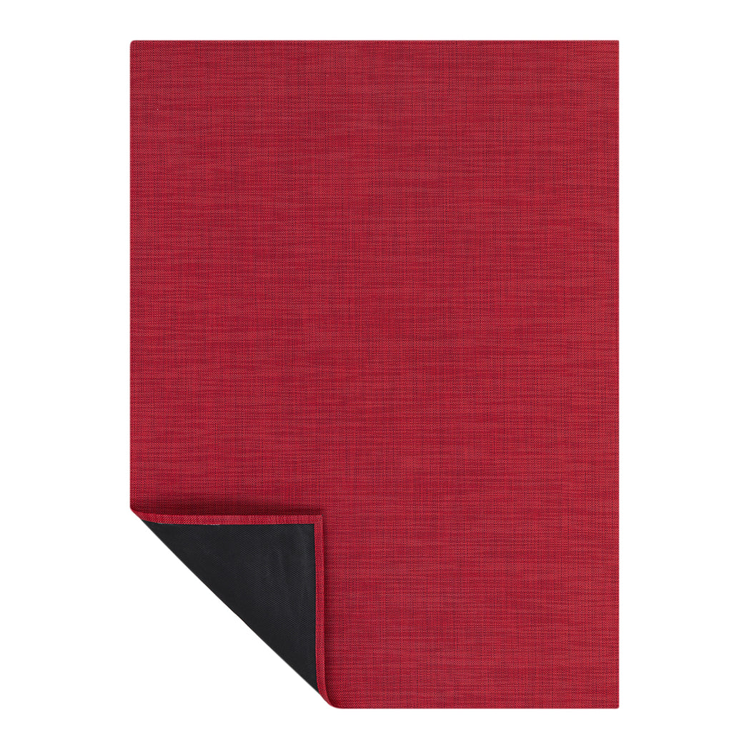 Chilewich Basketweave floor mat in Scarlet, showcasing woven terrastrand yarn texture and modern design aesthetic.
