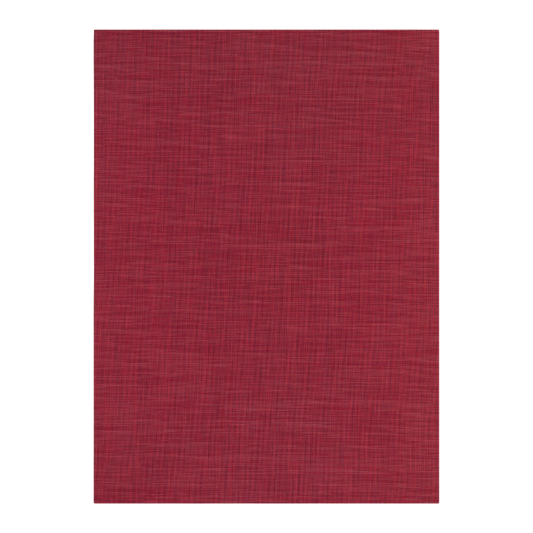 Chilewich Basketweave floor mat in Scarlet, showcasing woven terrastrand yarn texture and modern design aesthetic.