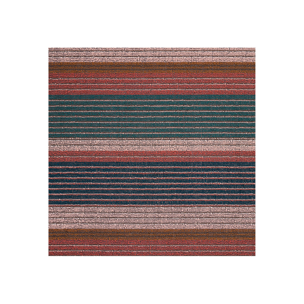 Chilewich striped woven mat with textured terrastrand yarn surface, featuring modern linear design and durable finish.