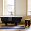 Chilewich striped woven mat with textured terrastrand yarn surface, featuring modern linear design and durable finish.