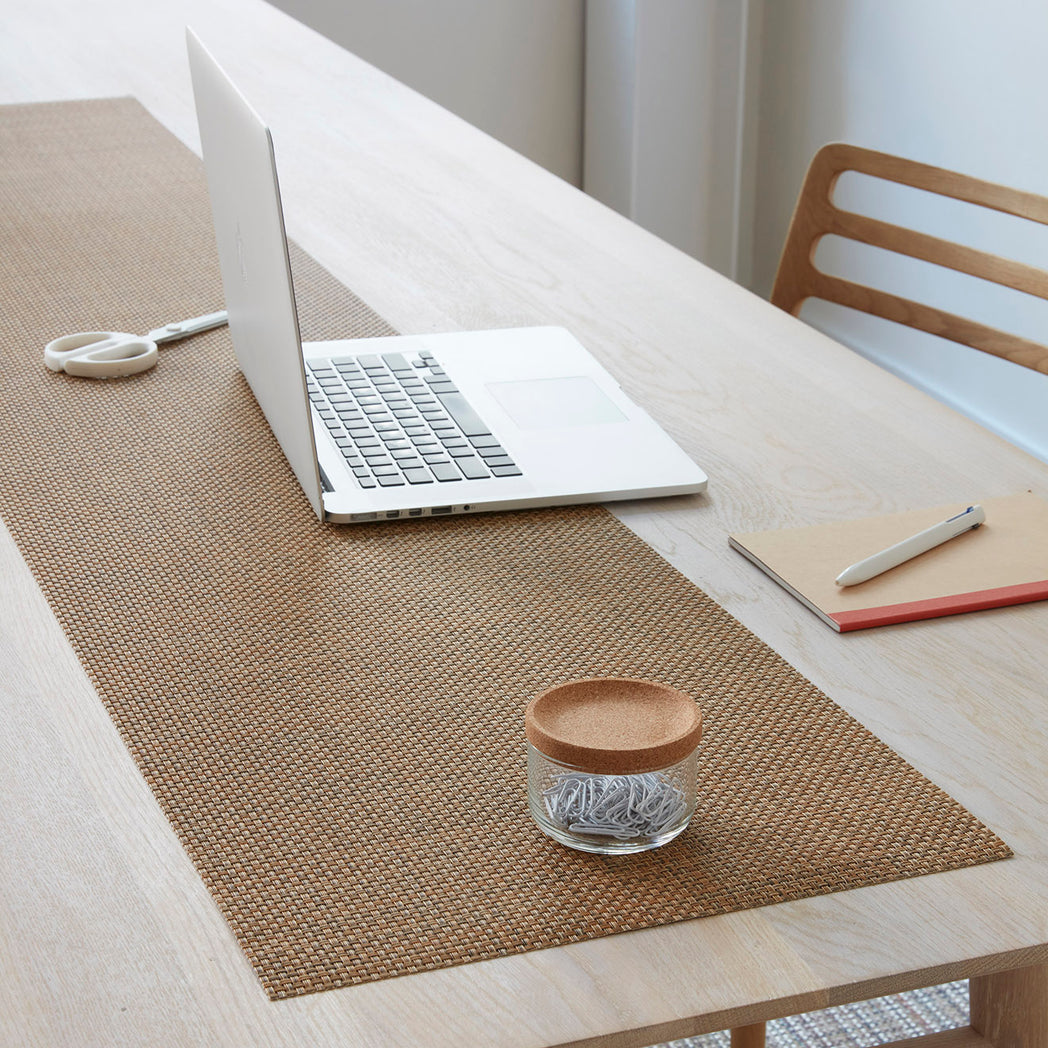 Chilewich Basketweave floor mat in Teak, showcasing woven terrastrand yarn texture and modern design aesthetic.