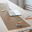 Chilewich Basketweave floor mat in Teak, showcasing woven terrastrand yarn texture and modern design aesthetic.