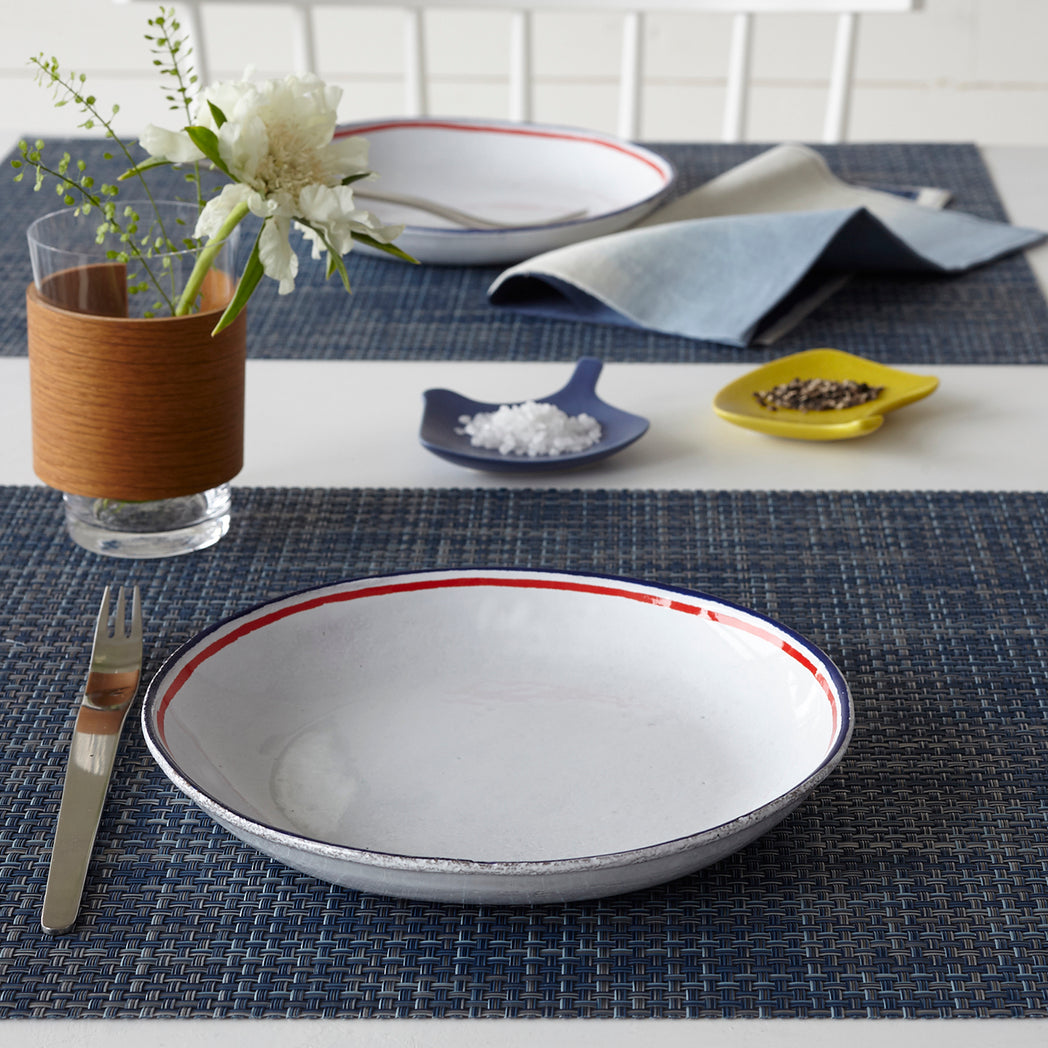 Chilewich Basketweave floor mat in Denim, showcasing woven terrastrand yarn texture and modern design aesthetic.