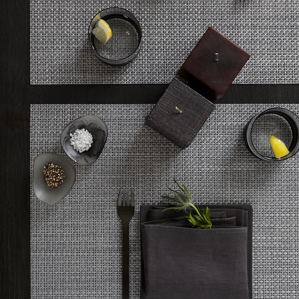 Chilewich Basketweave floor mat in Shadow, showcasing woven terrastrand yarn texture and modern design aesthetic.