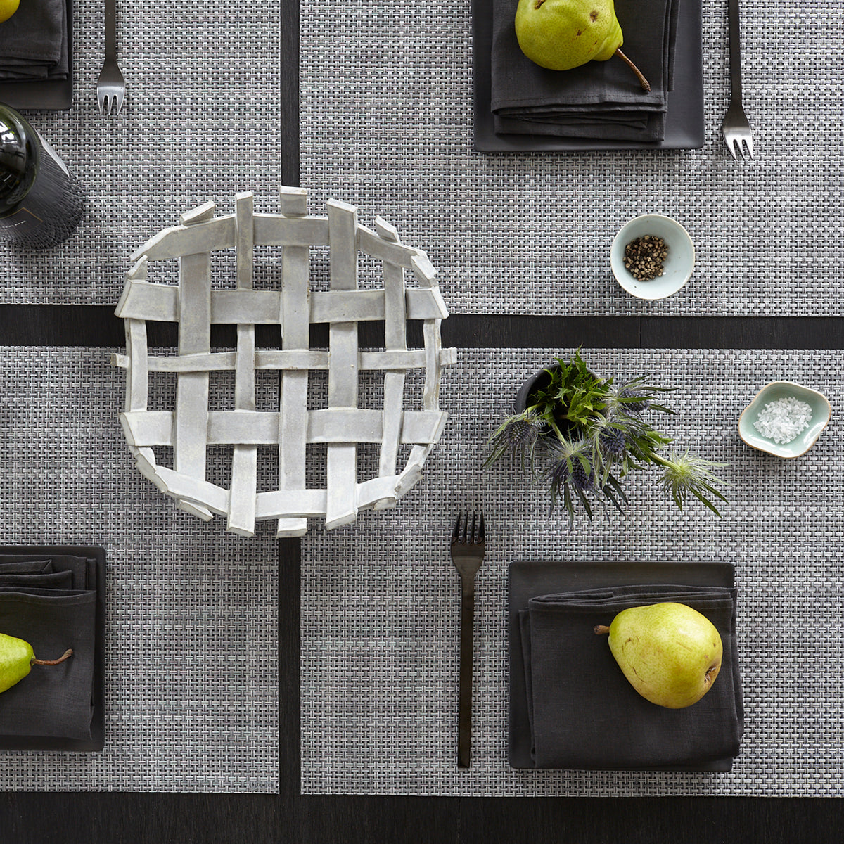 Chilewich Basketweave floor mat in Shadow, showcasing woven terrastrand yarn texture and modern design aesthetic.