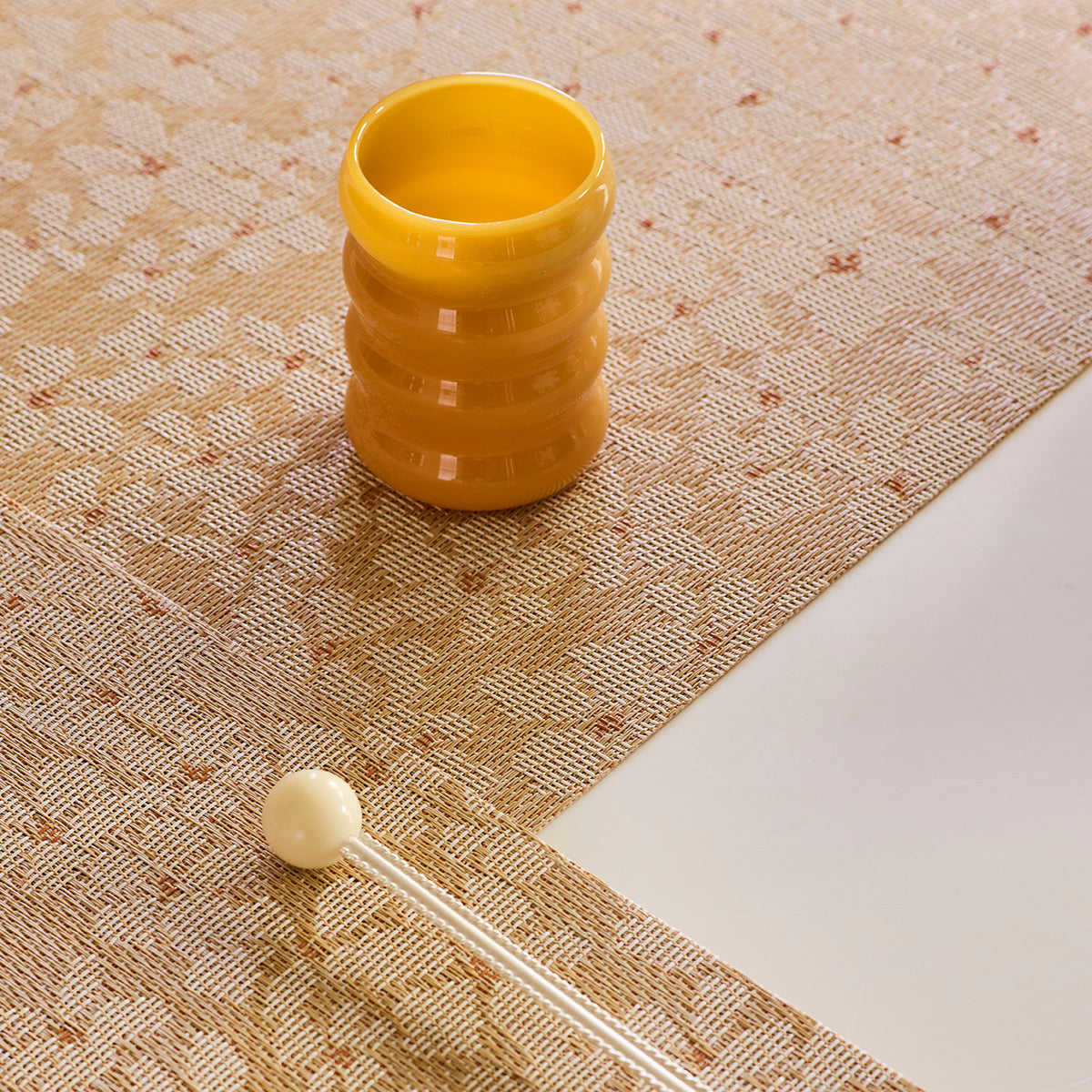 Detail image of Chilewich woven material showcasing texture, color, and pattern of the terrastrand yarn weave.