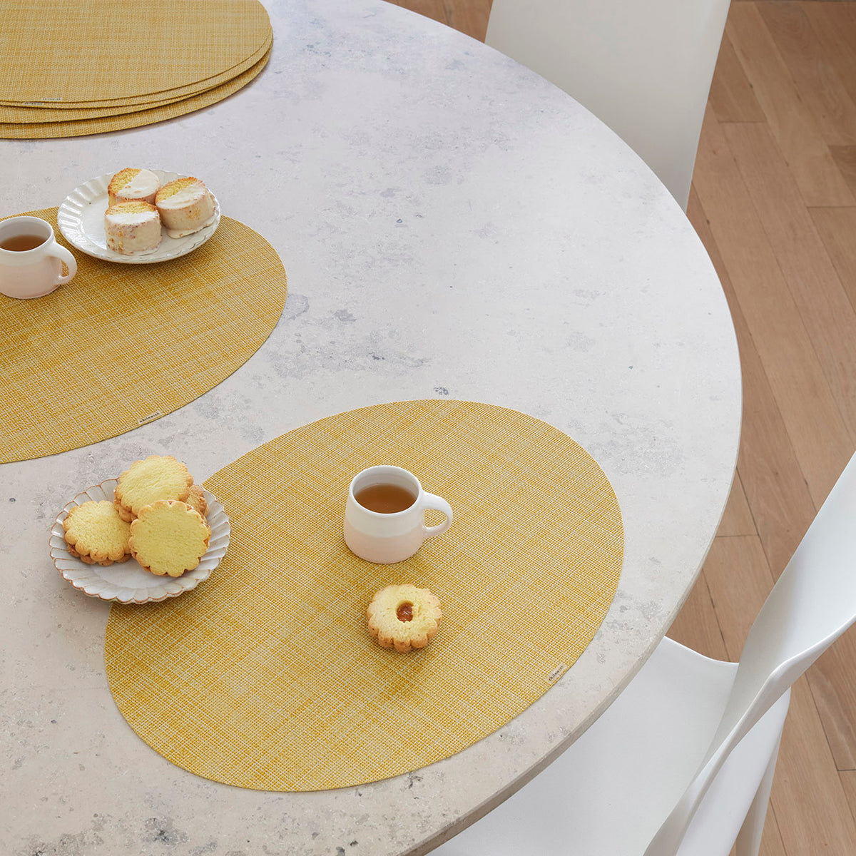 Chilewich Basketweave floor mat in Ochre, showcasing woven terrastrand yarn texture and modern design aesthetic.