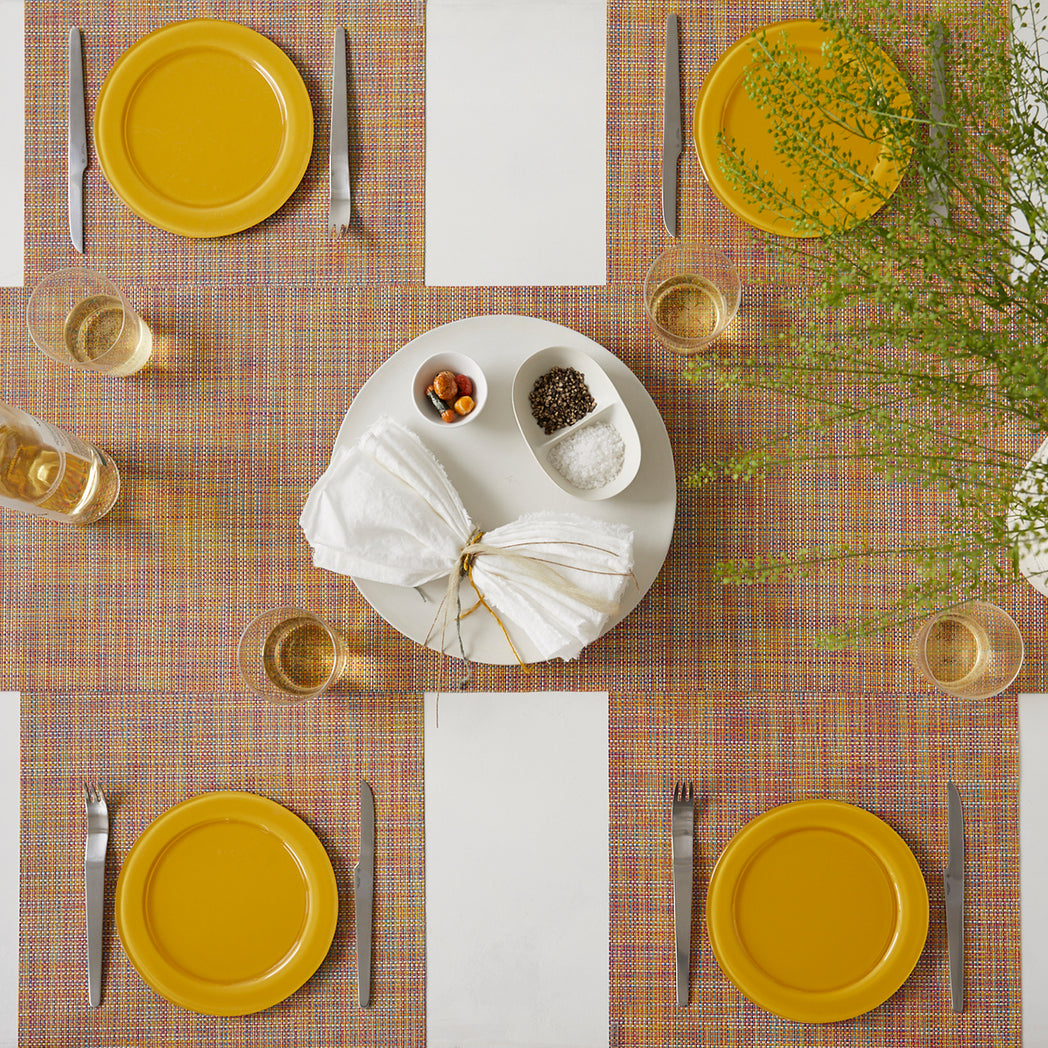 Chilewich Basketweave floor mat in Confetti, showcasing woven terrastrand yarn texture and modern design aesthetic.