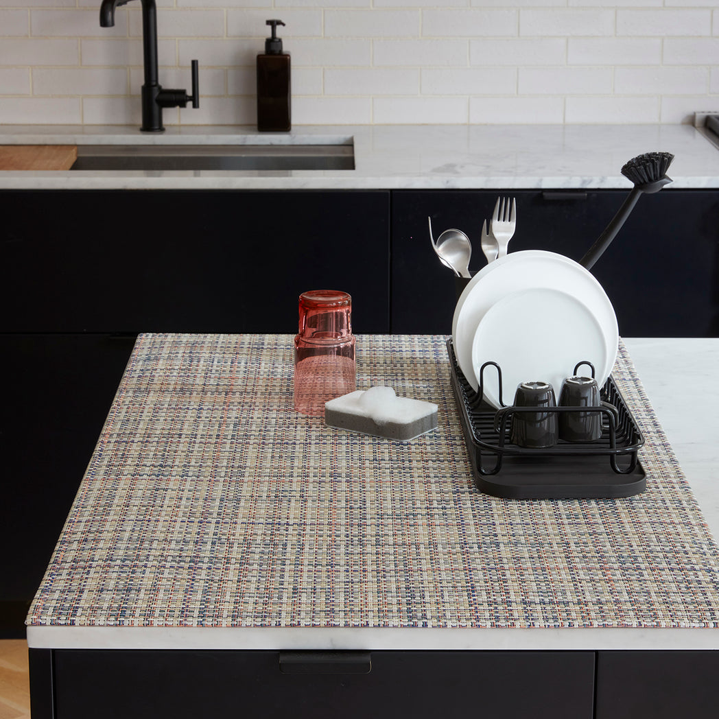 Chilewich Basketweave floor mat in BonBon, showcasing woven terrastrand yarn texture and modern design aesthetic.