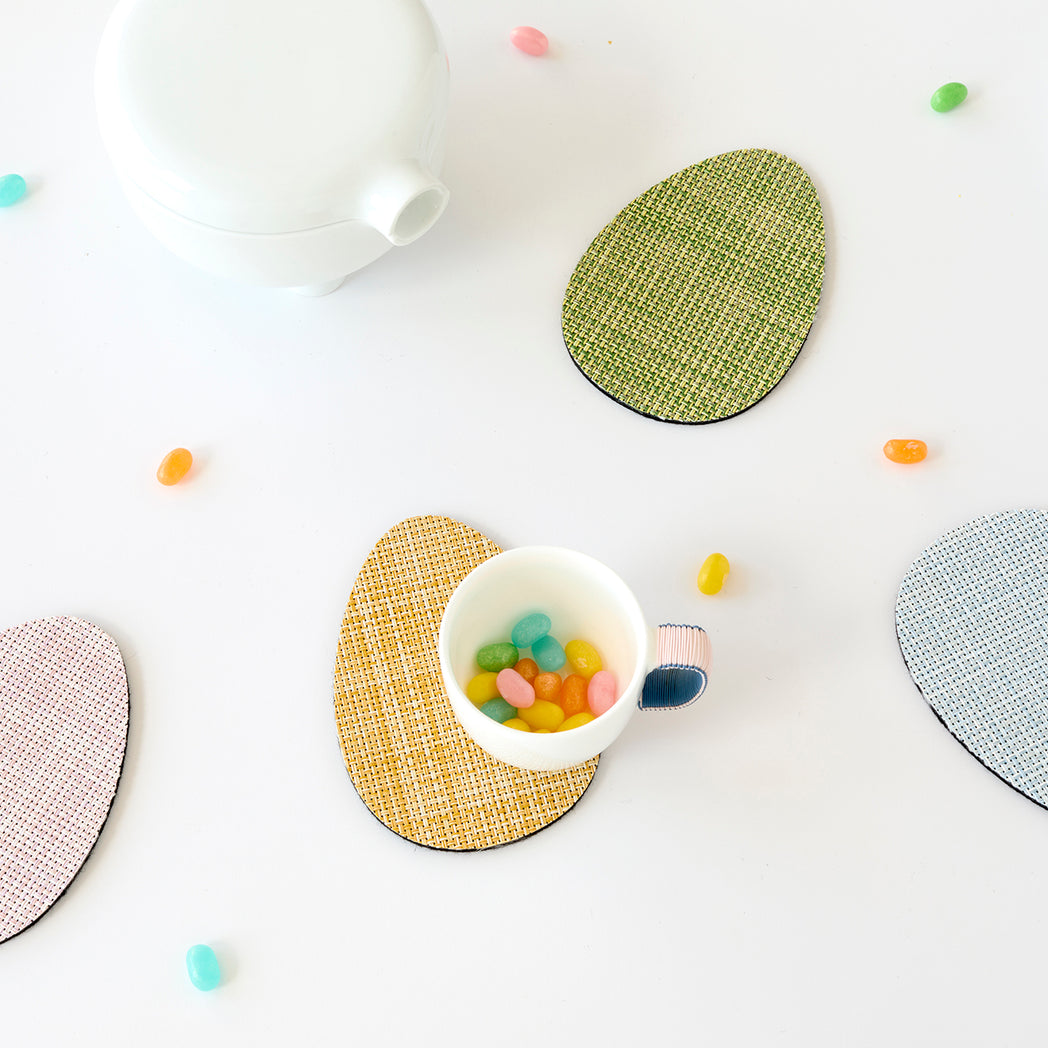 Chilewich Basketweave floor mat in egg, showcasing woven terrastrand yarn texture and modern design aesthetic.