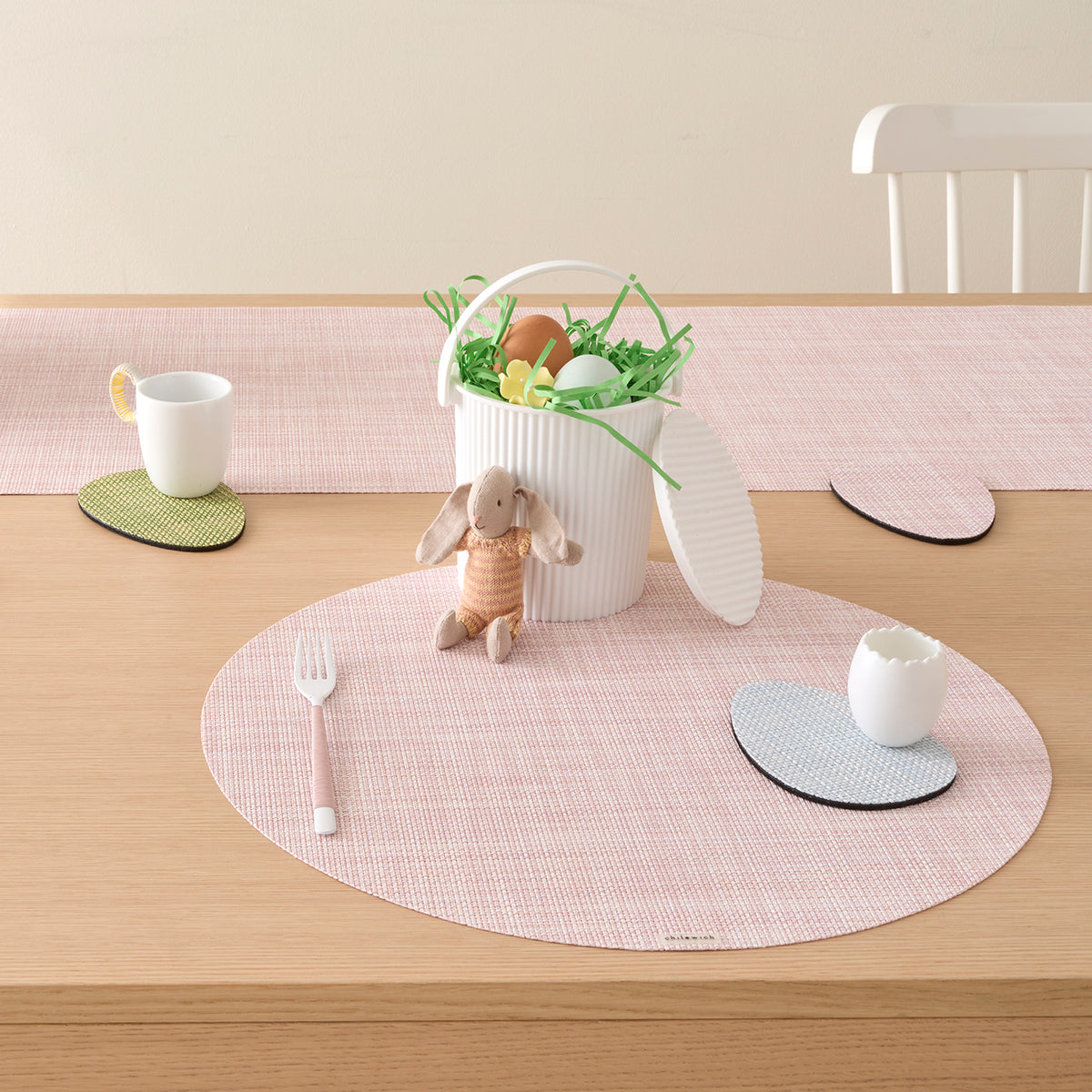 Chilewich Basketweave floor mat in egg, showcasing woven terrastrand yarn texture and modern design aesthetic.