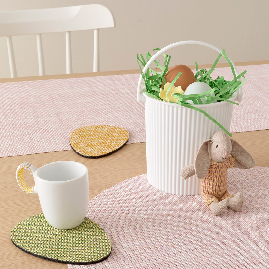 Chilewich Basketweave floor mat in egg, showcasing woven terrastrand yarn texture and modern design aesthetic.