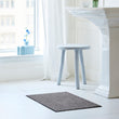 Chilewich woven floor mat in neutral woven terrastrand yarn, durable and stylish for modern living spaces.