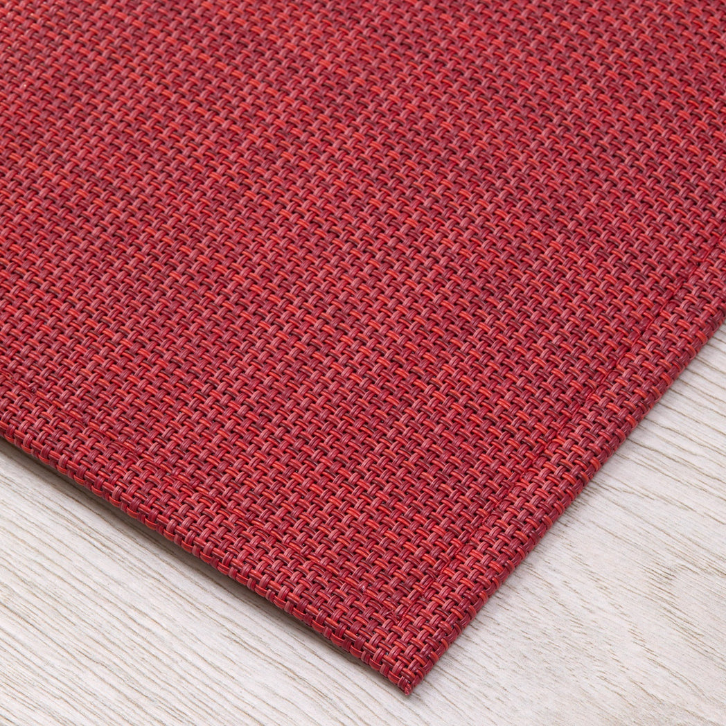 Chilewich Basketweave floor mat in scarlet, showcasing woven terrastrand yarn texture and modern design aesthetic.