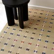 Chilewich woven floor mat in neutral woven terrastrand yarn, durable and stylish for modern living spaces.