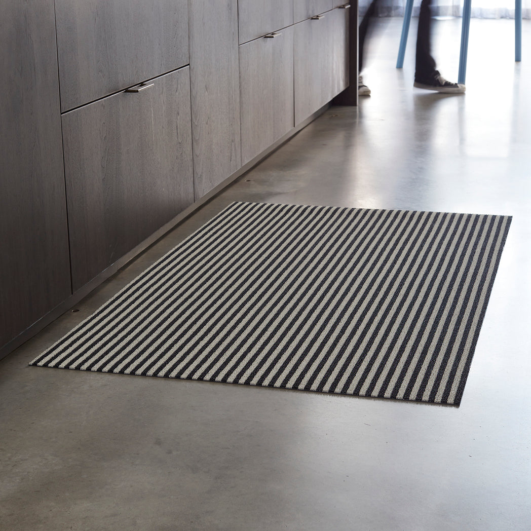 Chilewich woven floor mat in neutral woven terrastrand yarn, durable and stylish for modern living spaces.