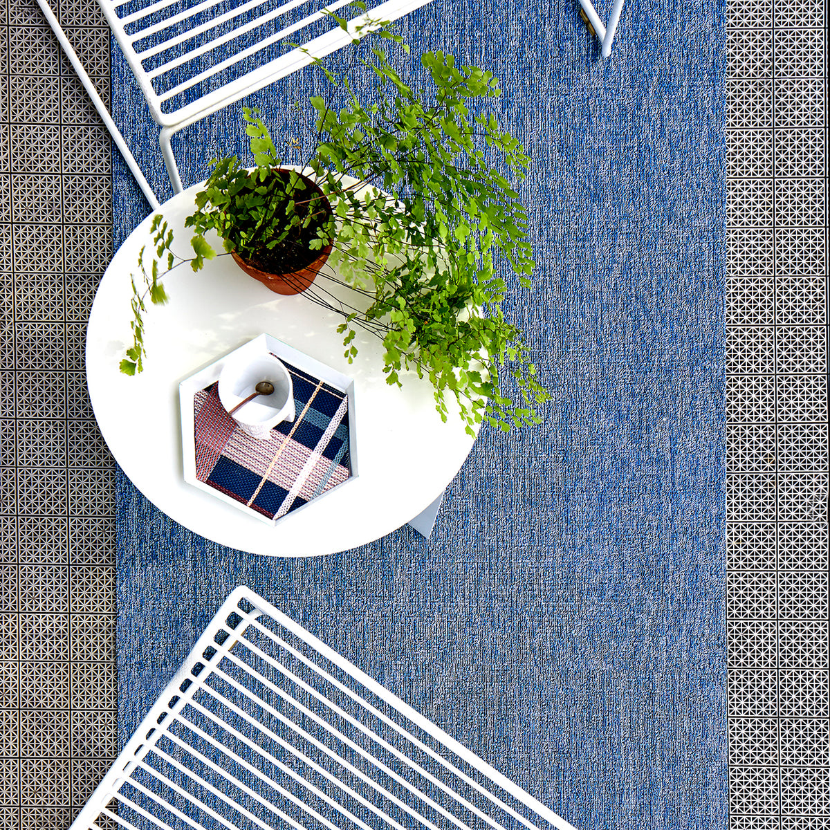 Chilewich woven floor mat in neutral woven terrastrand yarn, durable and stylish for modern living spaces.