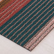 Chilewich striped woven mat with textured terrastrand yarn surface, featuring modern linear design and durable finish.