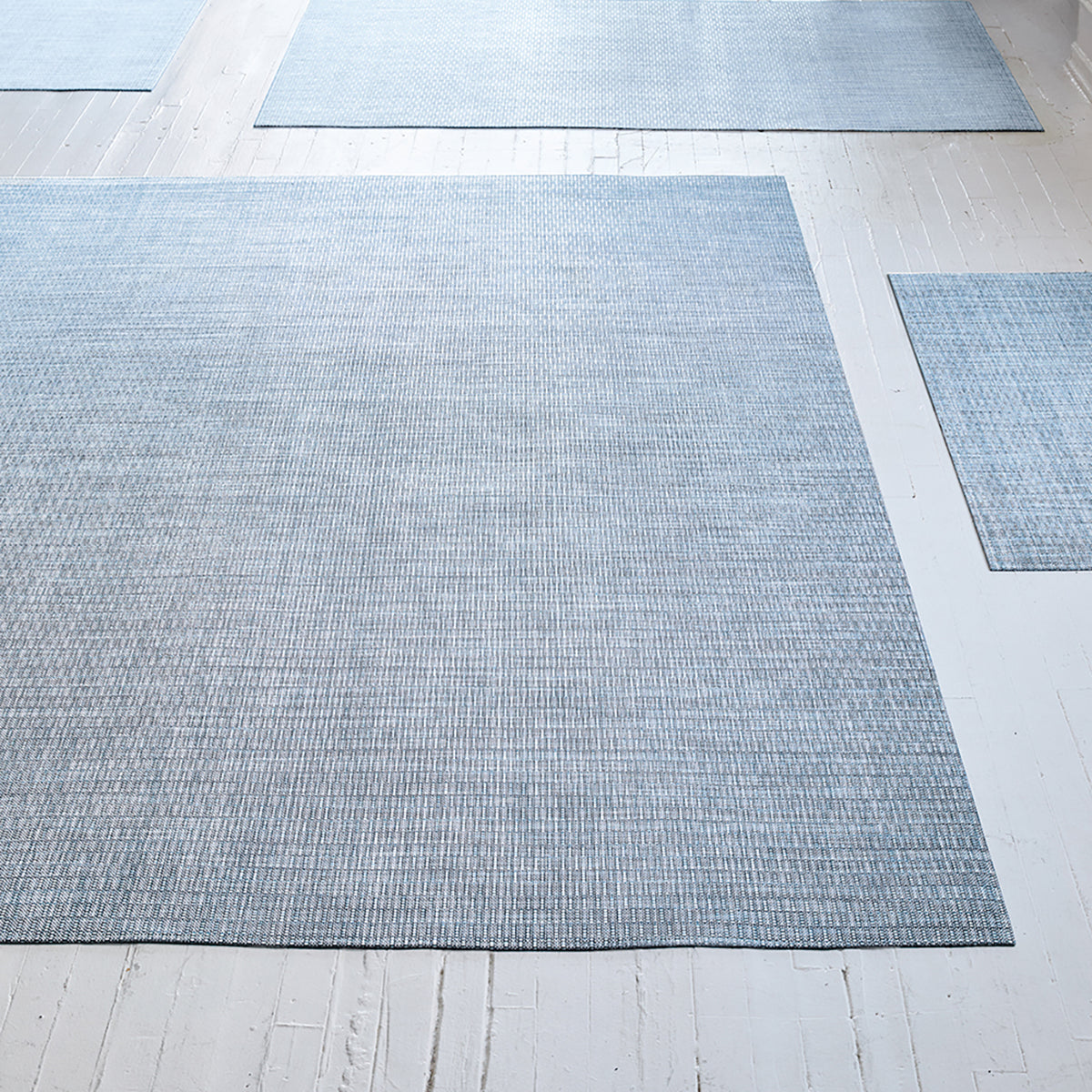 Chilewich woven floor mat in neutral woven terrastrand yarn, durable and stylish for modern living spaces.