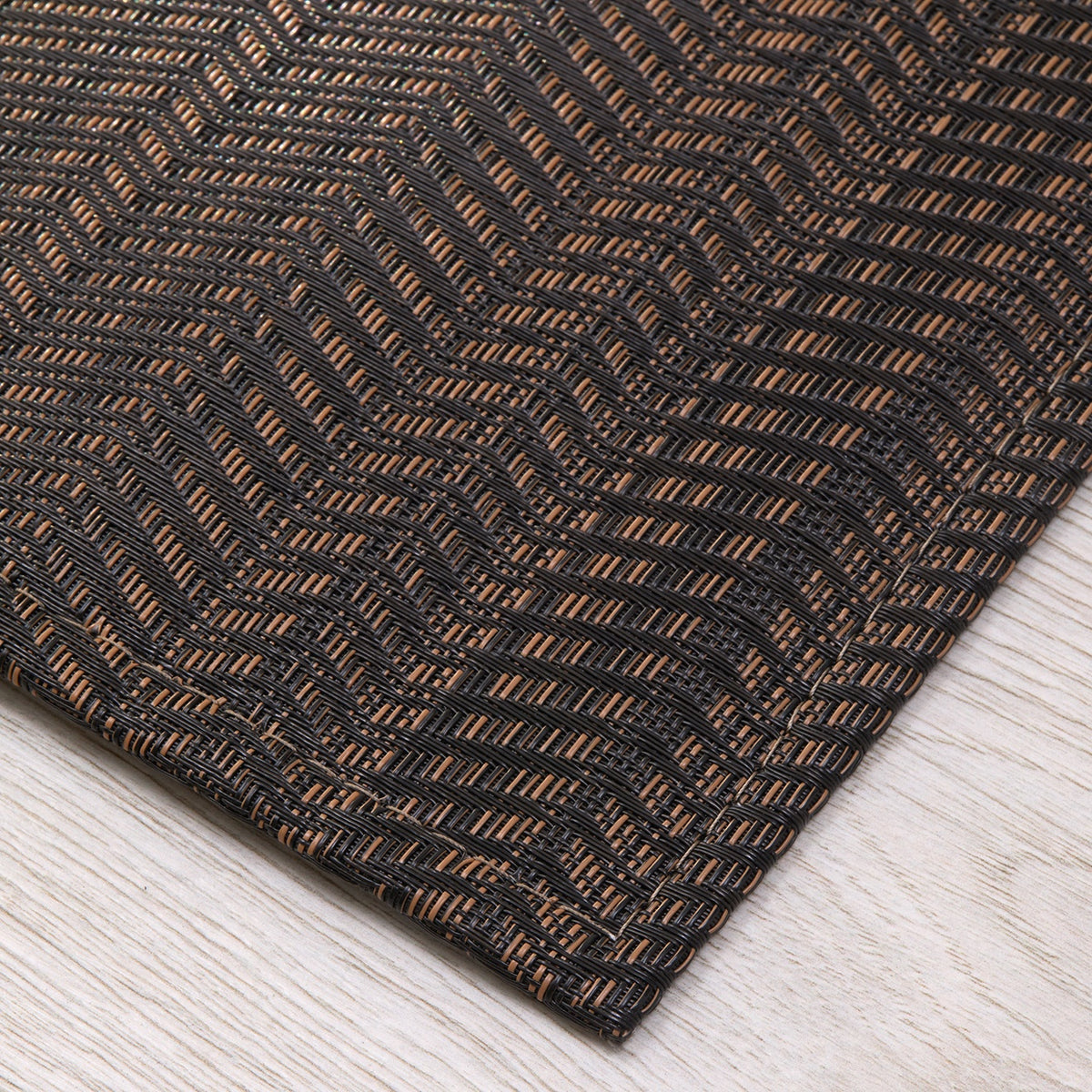 Chilewich woven floor mat in neutral woven terrastrand yarn, durable and stylish for modern living spaces.