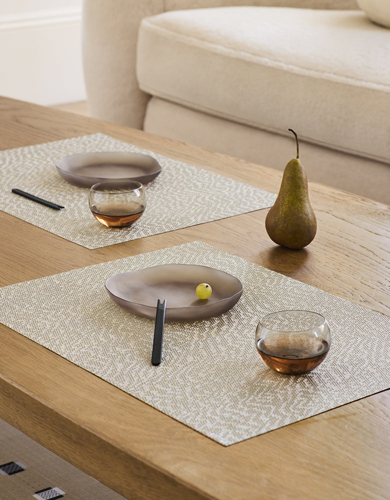 Chilewich woven placemat with subtle texture and contemporary design, ideal for dining and tabletop decor.