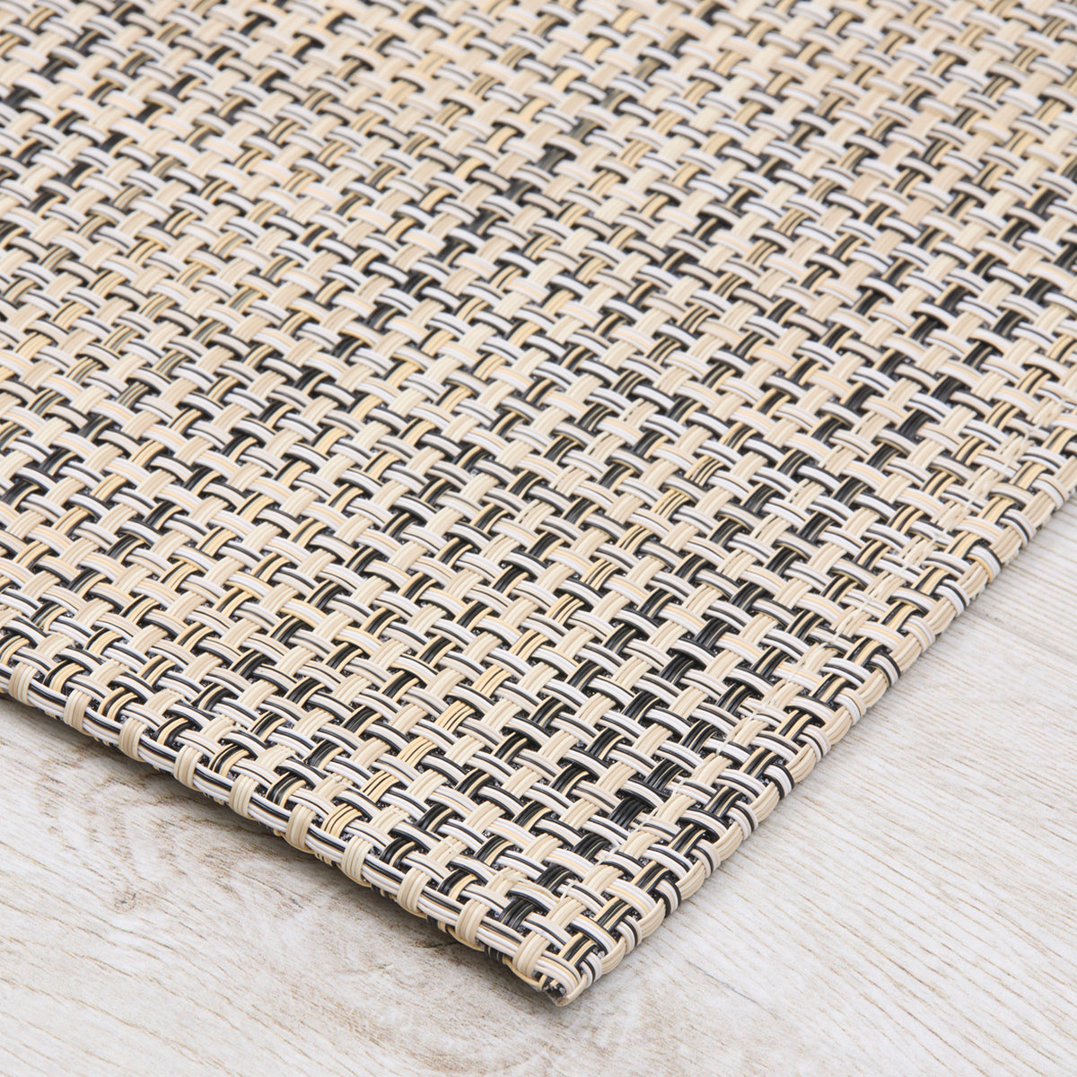 Chilewich Basketweave floor mat in buckwheat, showcasing woven terrastrand yarn texture and modern design aesthetic.