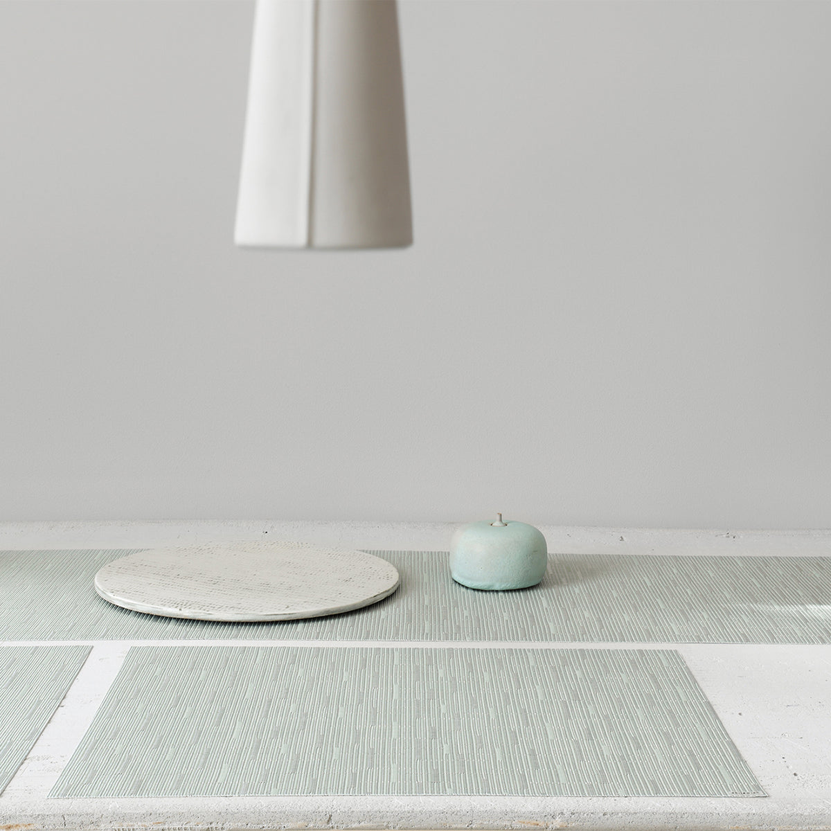 Detail image of Chilewich woven material showcasing texture, color, and pattern of the terrastrand yarn weave.