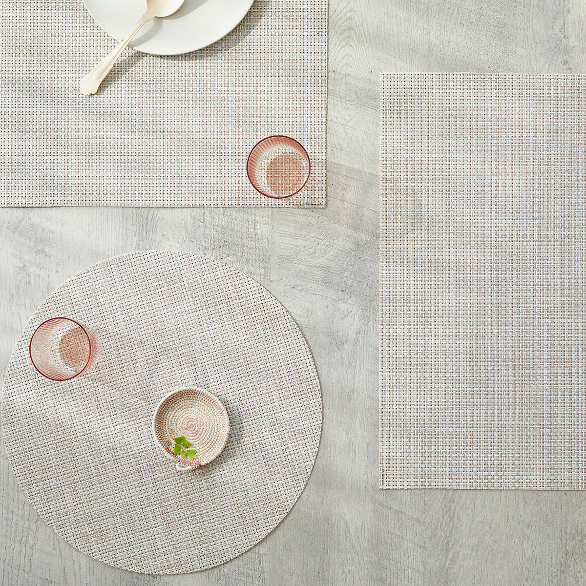 Chilewich Basketweave floor mat in natural, showcasing woven terrastrand yarn texture and modern design aesthetic.