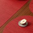 Chilewich Basketweave floor mat in scarlet, showcasing woven terrastrand yarn texture and modern design aesthetic.