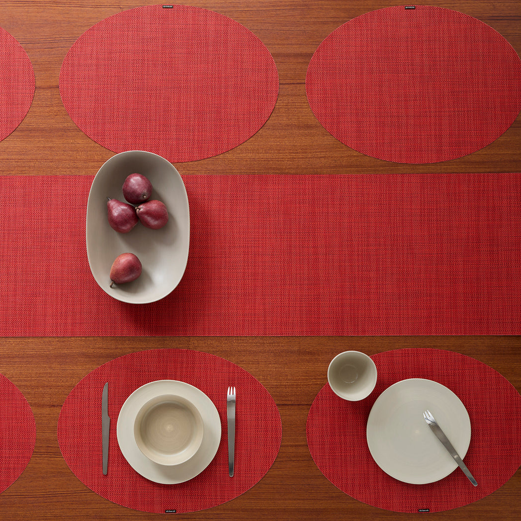 Chilewich Basketweave floor mat in scarlet, showcasing woven terrastrand yarn texture and modern design aesthetic.